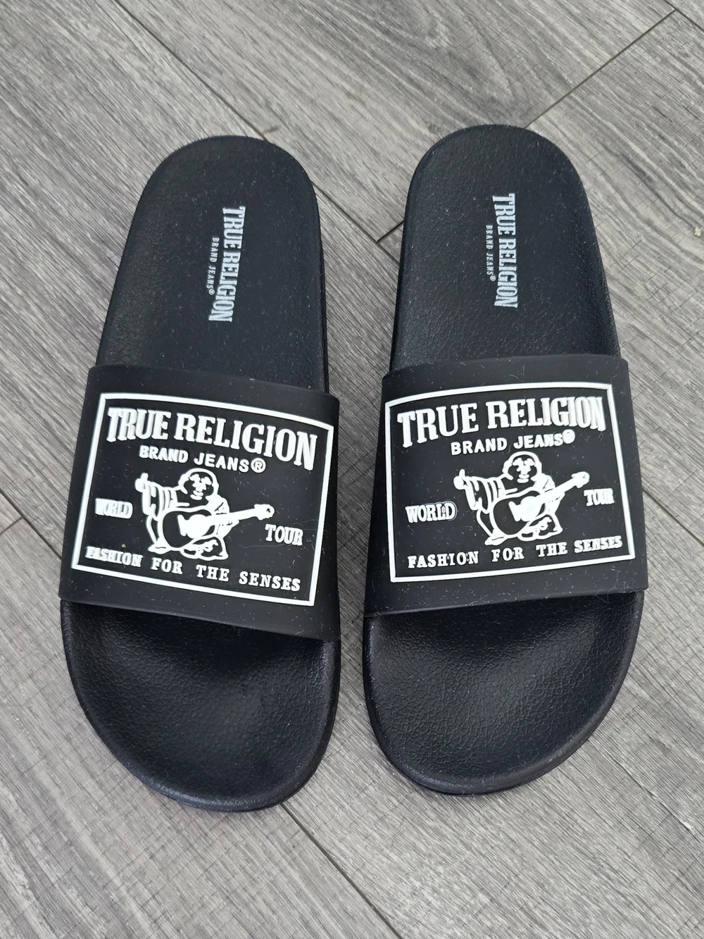 NWOT True Religion black slide sandals in men’s US size 9.